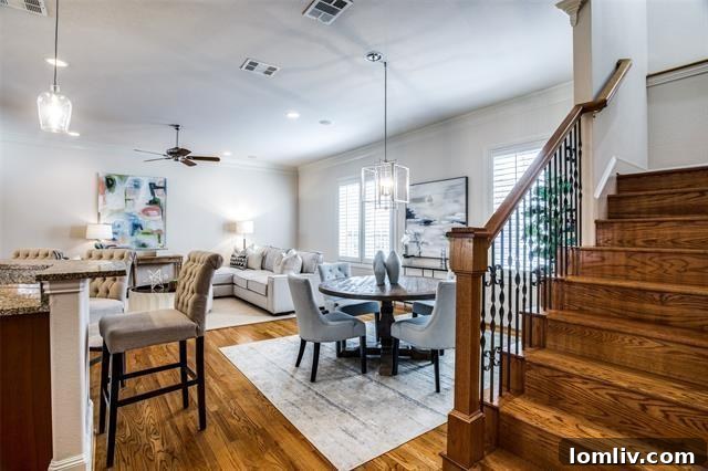 Spacious open-concept living area with fireplace and abundant natural light