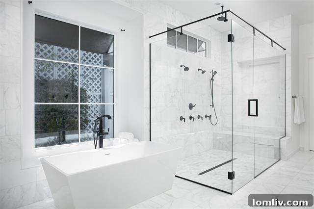 Spacious laundry room with ample storage and high-end machines