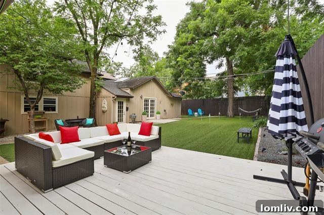 Lush backyard with ample space for outdoor activities and potential guest house