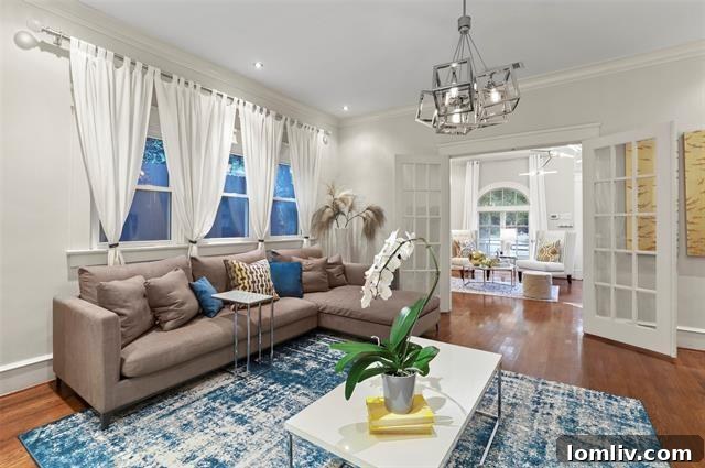 Spacious den area with a unique yellow barn bypass door