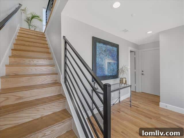 Spacious and open-concept living area bathed in natural light, showcasing modern design elements.