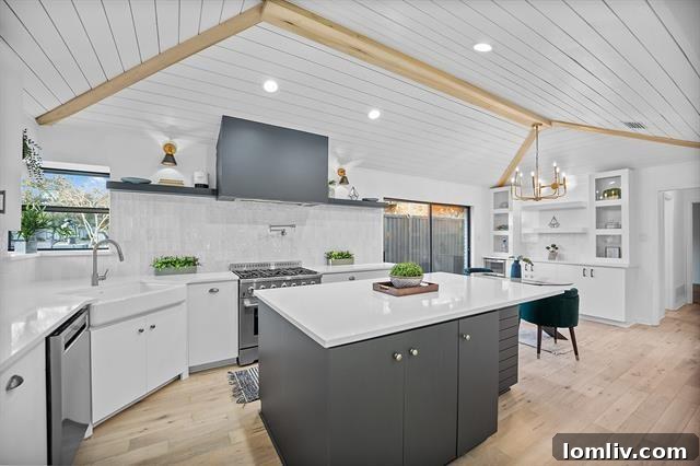 Living room with an exposed brick fireplace and elegant marble floors in a remodeled Dallas mid-century modern house.