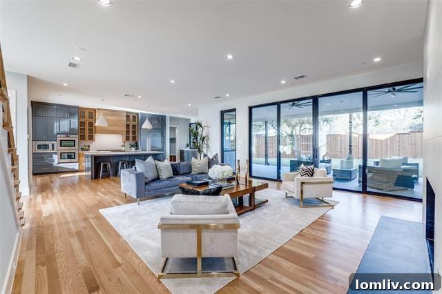 Spacious and modern living area with a floor-to-ceiling fireplace, ideal for entertaining in this Dallas luxury property.