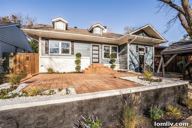 Charming updated home in Lake Highlands, Dallas, inviting visitors to its open house event.