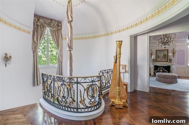 Opulent master bathroom featuring high-end fixtures, dual vanities, intricate tile work, and a freestanding tub