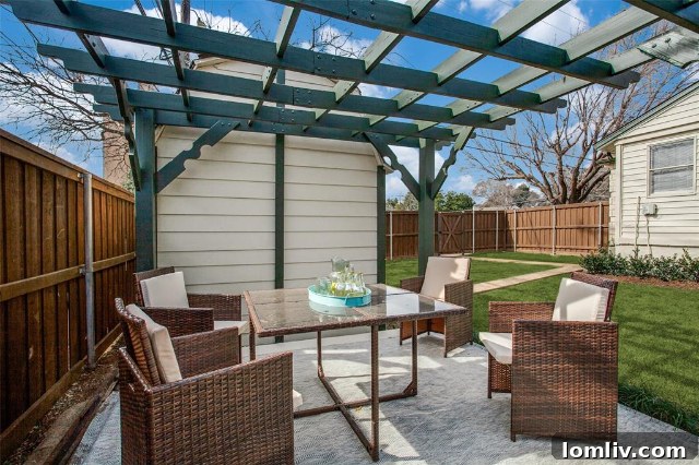 Remodeled kitchen with quartz countertops and stainless steel appliances