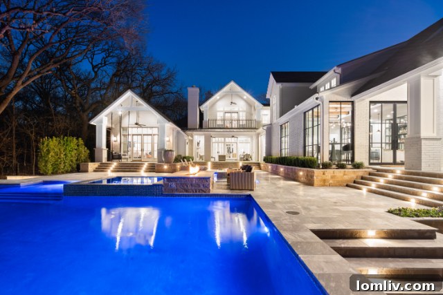 Elegant infinity pool with lush landscaping at 1050 Three Oaks Drive