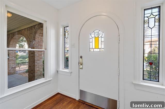A view of the charming front porch and meticulously maintained garden of 130 Appian Way, exuding classic curb appeal.