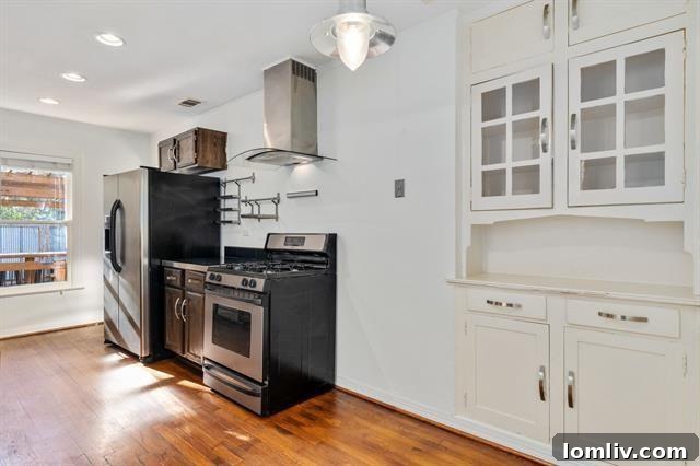 Interior view showcasing the beautifully restored original stained glass windows, bathing the room in colorful light.