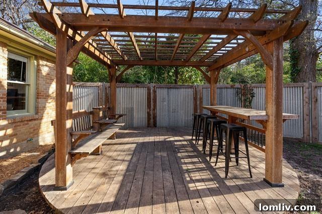 The recently added round deck with bar seating and an arbor, perfect for outdoor entertaining and relaxation.