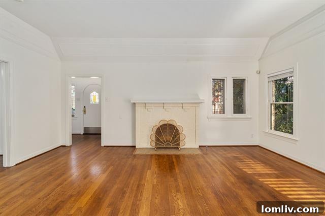 The elegant fireplace with a unique scalloped screen, a captivating focal point of the main living area, reflecting Tudor artistry.