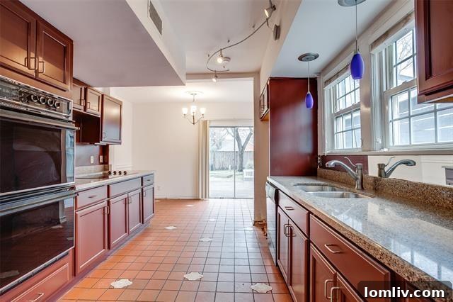 Bright sunroom with large picture windows overlooking garden