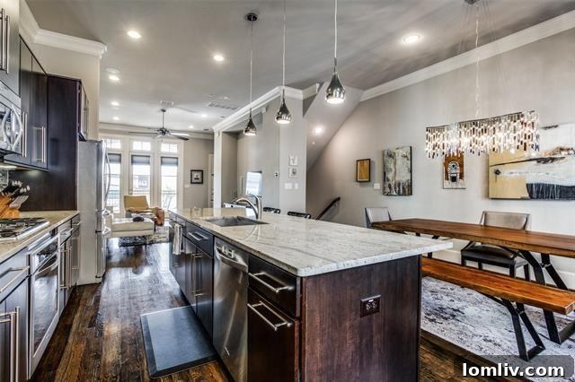 Gourmet kitchen with large island in contemporary Dallas home