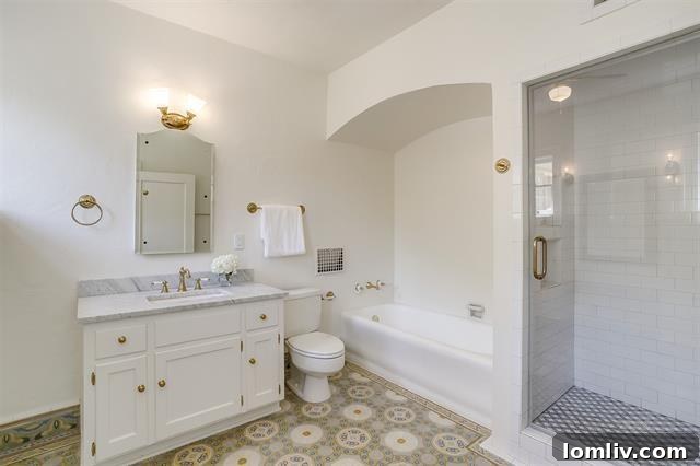 Exquisitely preserved vintage Batchelder tile bathroom after renovation, maintaining its original Art Nouveau charm at 2200 Winton Terrace E.