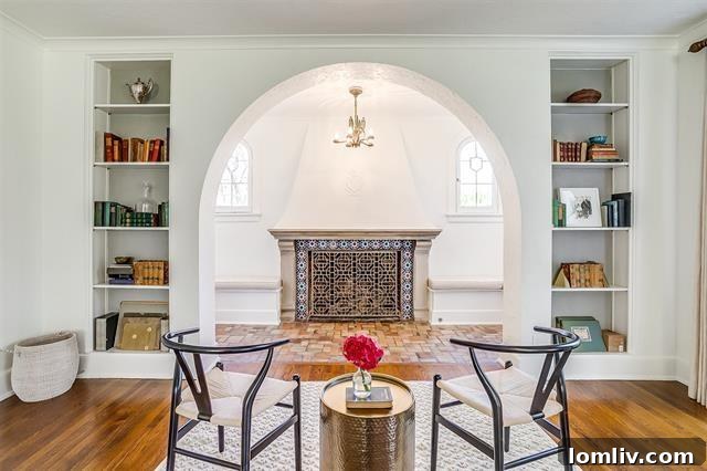 Luxurious and inviting living space with high ceilings and ample natural light in the historic Winton Terrace home.