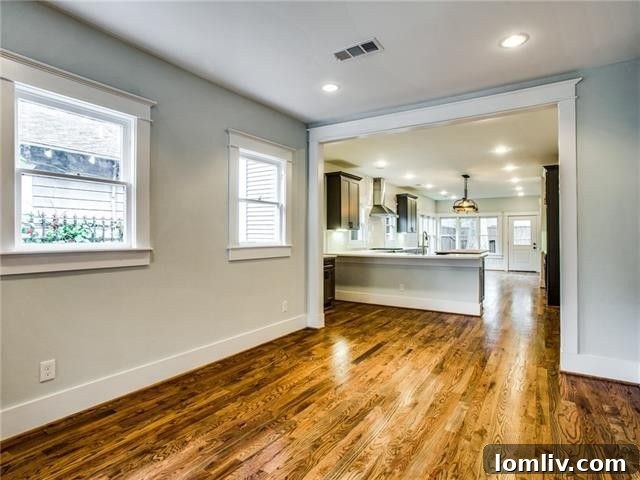 Transformed open-concept living and dining area in the restored 5307 Worth Street home.