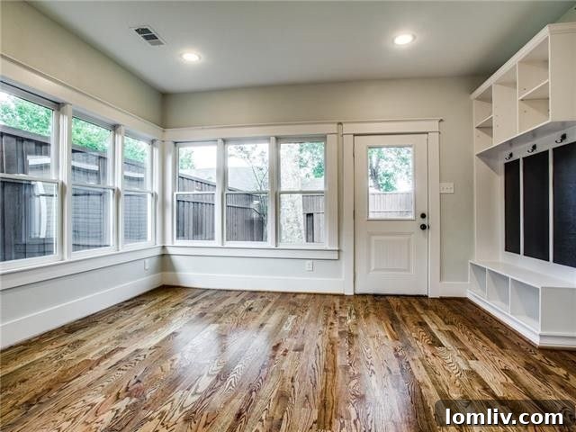 Interior view showcasing exposed shiplap ceiling and chimney in the restored home.