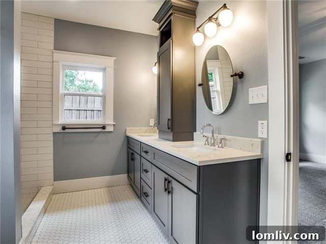 Bathroom renovation featuring modern fixtures and classic styling in the historic Dallas home.