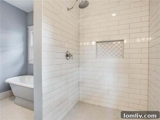 Bedroom with original character and modern finishes in the renovated 5307 Worth Street residence.