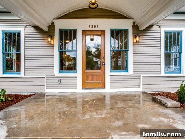Restored historic home porch, showcasing new structural integrity and aesthetic appeal.