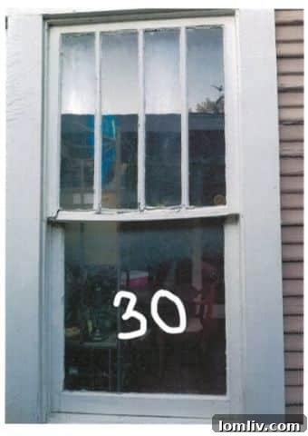 Restored original wood windows of the 5307 Worth Street historic home.