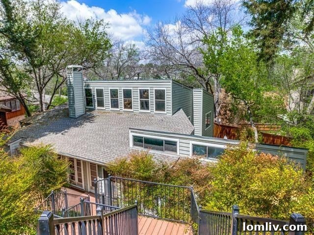 Lush greenery and architectural details of a Kessler Park home on Nob Hill Drive
