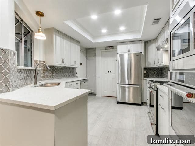 Modern Kitchen with Custom Grey Cabinetry and Stainless Steel Appliances