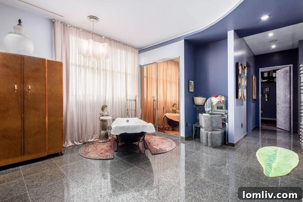Bathtub positioned openly within the master bedroom space
