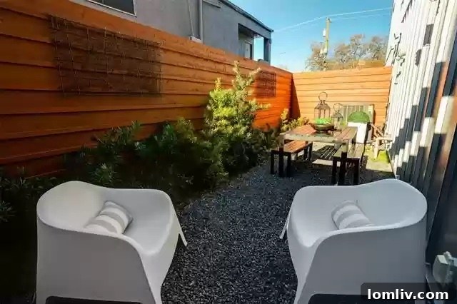 Two Coveted Oak Lawn Residences For Sale 20 Another view of the sophisticated living space, emphasizing the statement fireplace