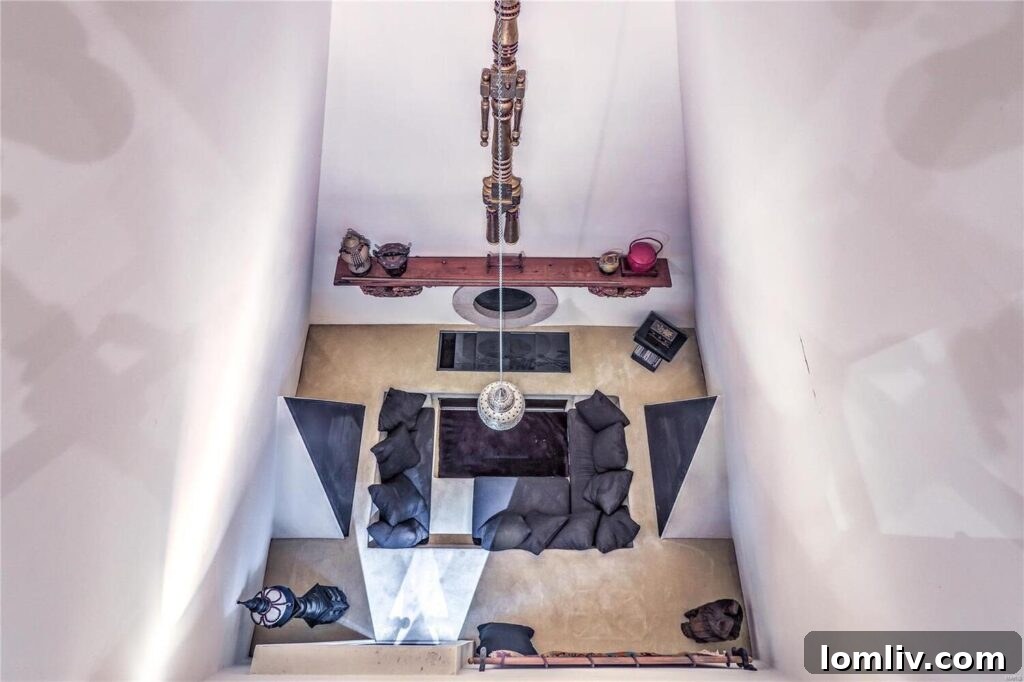 A dark, dramatic, and uniquely styled room, playfully dubbed the 'human sacrifice chamber'