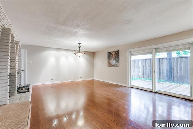 Discover Dallas Open Houses: Lower Greenville to Lake Highlands 16 Cozy sunroom overlooking a private backyard and swimming pool.