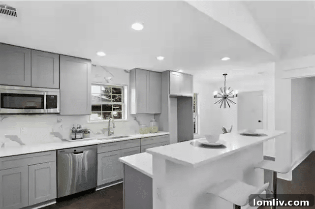 Uncover Lake Highlands: Unexpected Splurges and Smart Steals 12 Stylish bathroom with contemporary fixtures, designer tiles, and modern hardware in the renovated 11261 Cactus Lane home