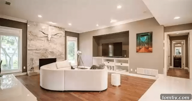 Uncover Lake Highlands: Unexpected Splurges and Smart Steals 4 Spacious open-concept living area in Lake Highlands luxury home with grand fireplace and abundant natural light
