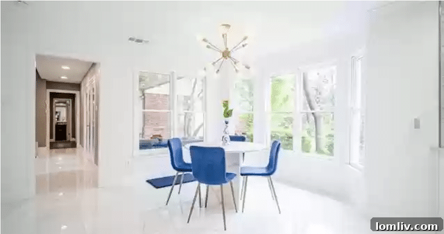 Uncover Lake Highlands: Unexpected Splurges and Smart Steals 6 Elegant dining nook with abundant natural light and views of the lush backyard in this renovated Lake Highlands residence