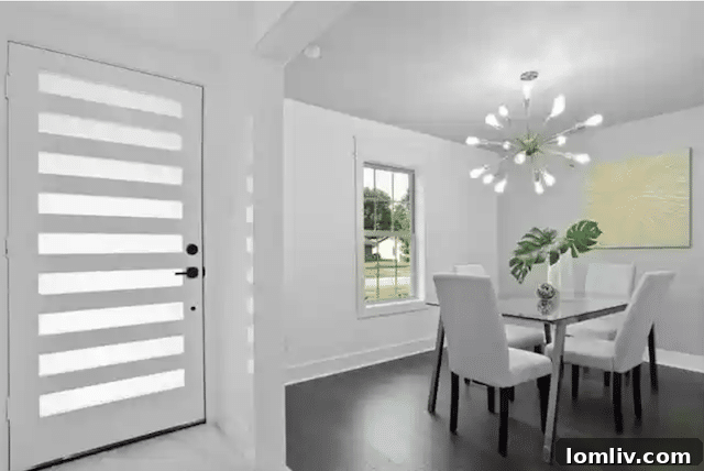 Uncover Lake Highlands: Unexpected Splurges and Smart Steals 10 Bright and airy open-concept living room with vaulted beamed ceilings and a dramatic fireplace in this affordable Dallas home