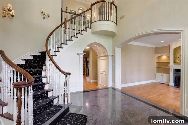 University Park's Georgian Jewel: Your Canvas for Custom Design 3 Luxurious primary suite bedroom with fireplace and seating area