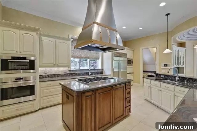 University Park's Georgian Jewel: Your Canvas for Custom Design 4 Gourmet kitchen with high-end stainless steel appliances and island