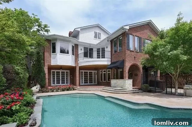 University Park's Georgian Jewel: Your Canvas for Custom Design 8 View of the expansive backyard and detached guest house in a luxury estate