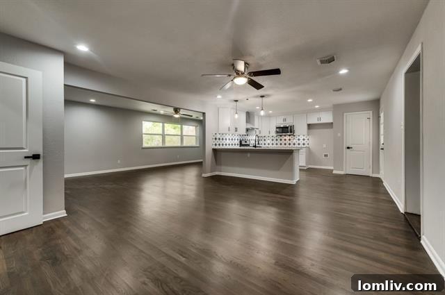 Lochwood Midcentury Modern Awaits Your Masterpiece 4 Spacious Living Room with Hardwood Floors in Dallas Lochwood Home