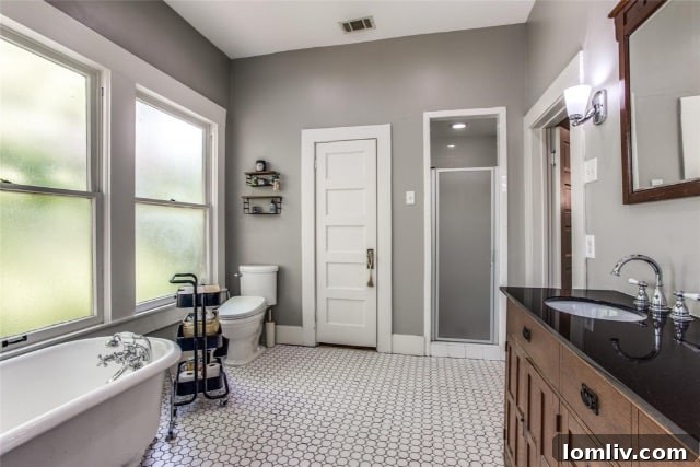 Elegant Fixtures and Finishes in the Master Bath of this Historic Dallas Home