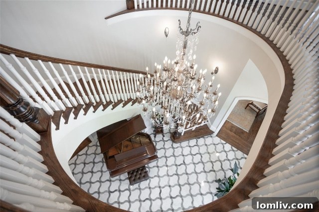 Regal entrance foyer and staircase of a stately home on Hamilton Avenue