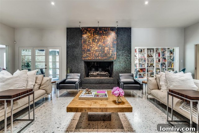 A view of the stately fireplace and living space at 5511 Royal Lane