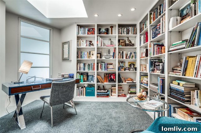 Cozy library or study area with built-in shelving at 5511 Royal Lane