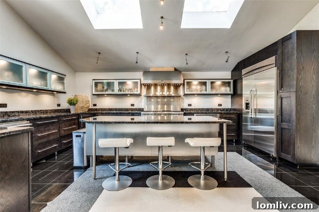 The master bedroom with an original stone fireplace at 5511 Royal Lane