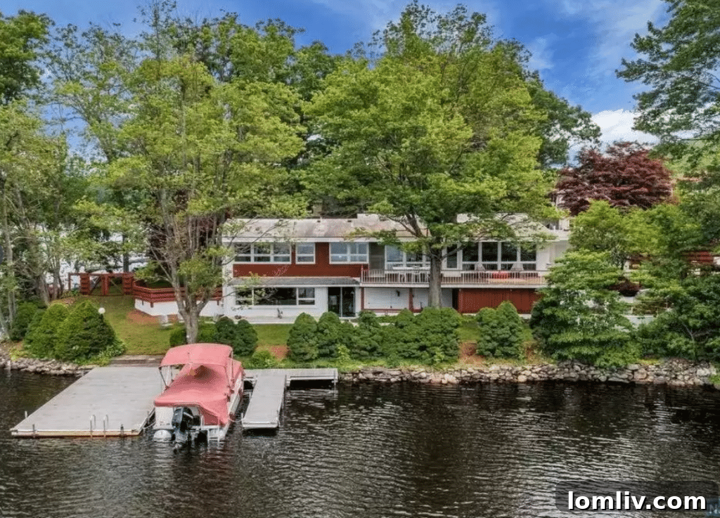 New Jersey's Midcentury Masterpiece Awaits 4 Interior view showcasing the open floor plan and lake views of the Midcentury Modern home
