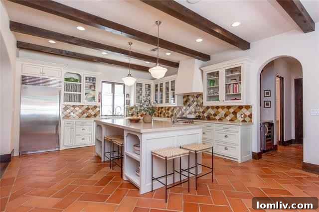 Mediterranean Masterpiece on Bunting Avenue 9 Gourmet eat-in kitchen with herringbone cotto floors and colorful backsplash