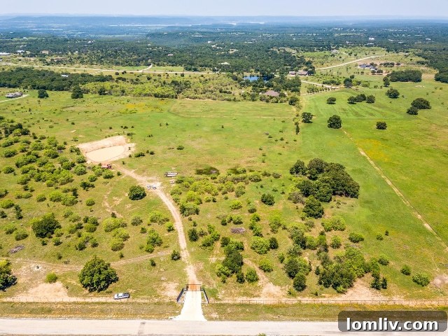Trees, diverse exotic animals, and stunning views all await on this premier 7-R Ranch property.