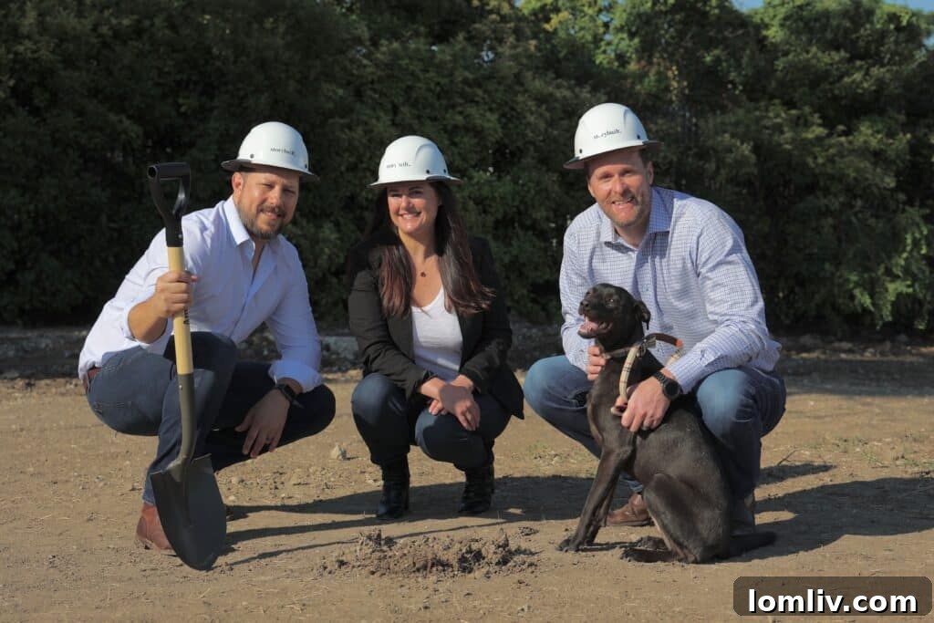 Adam Stetson with his dog Goose, surrounded by StoryBuilt principals