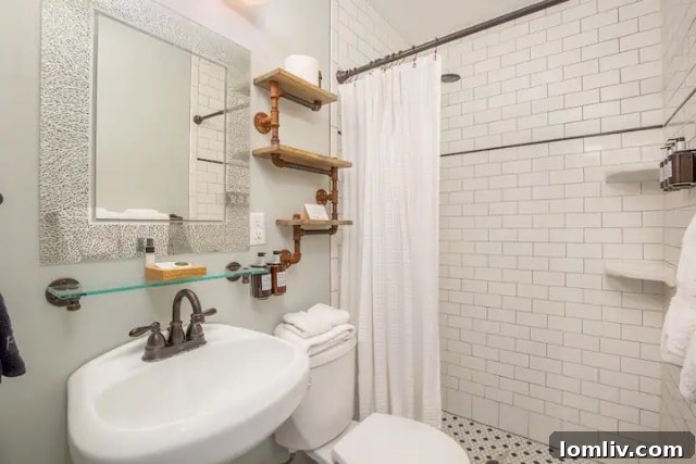 Inn on the Riverwalk Guest Room: Cozy and Inviting Bed with Antique Furnishings