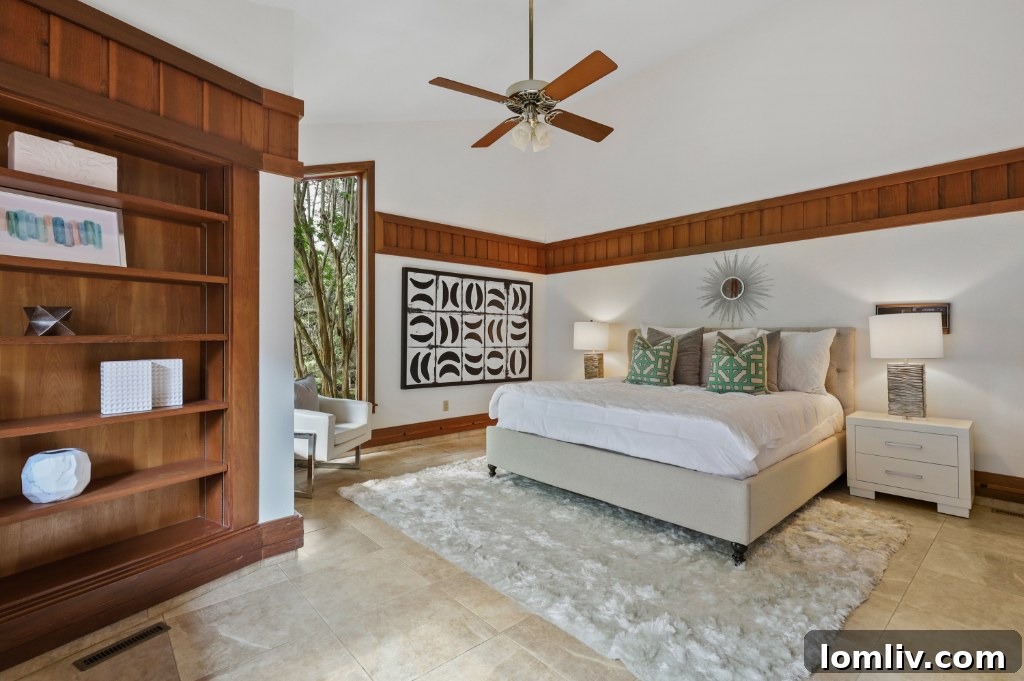 Elegant Bedroom with View of Green Treetops